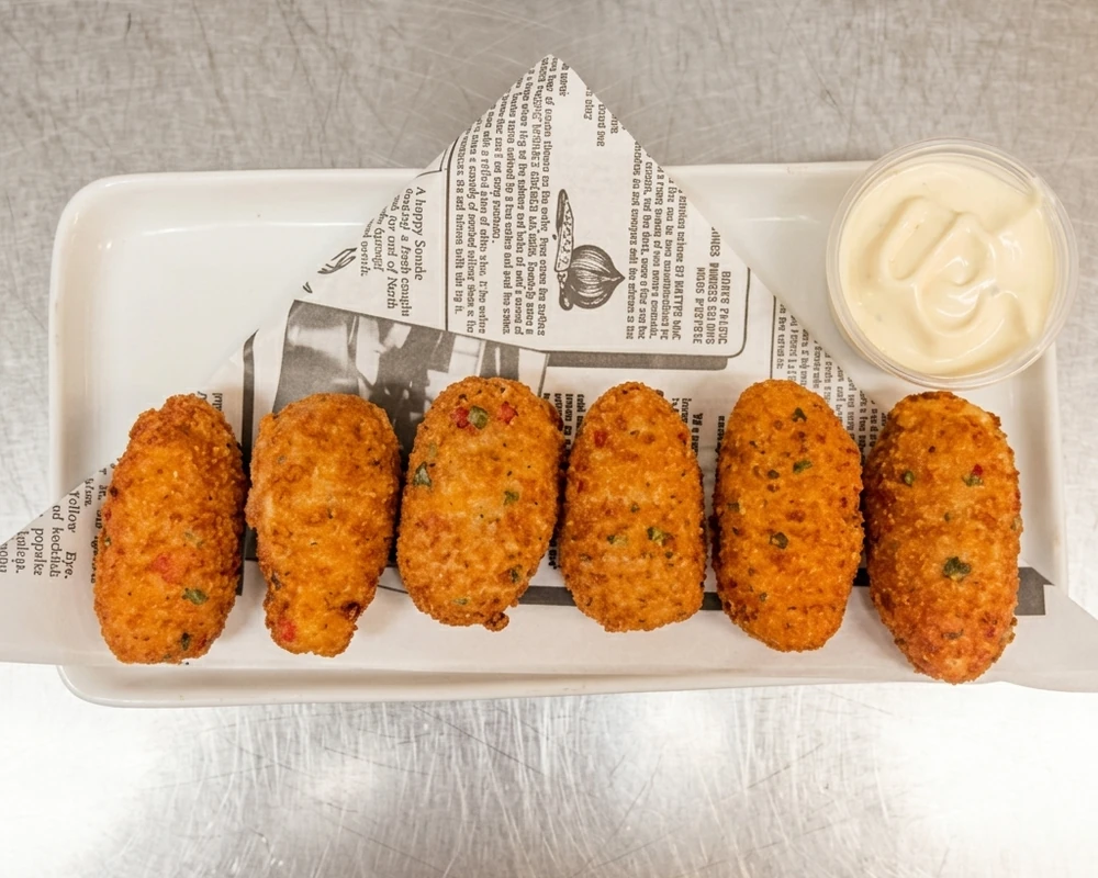 Six crispy jalapeno poppers at Binge Pizza, Calgary
