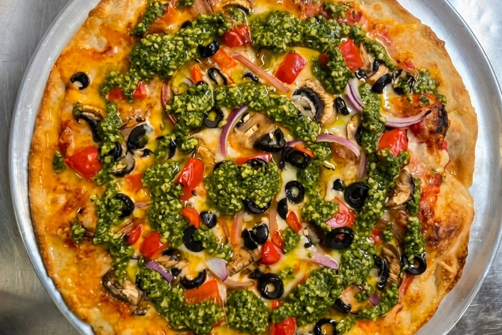 Vegetarian pizza with fresh mushrooms, peppers, onions and olives from Binge Pizza in southeast Calgary